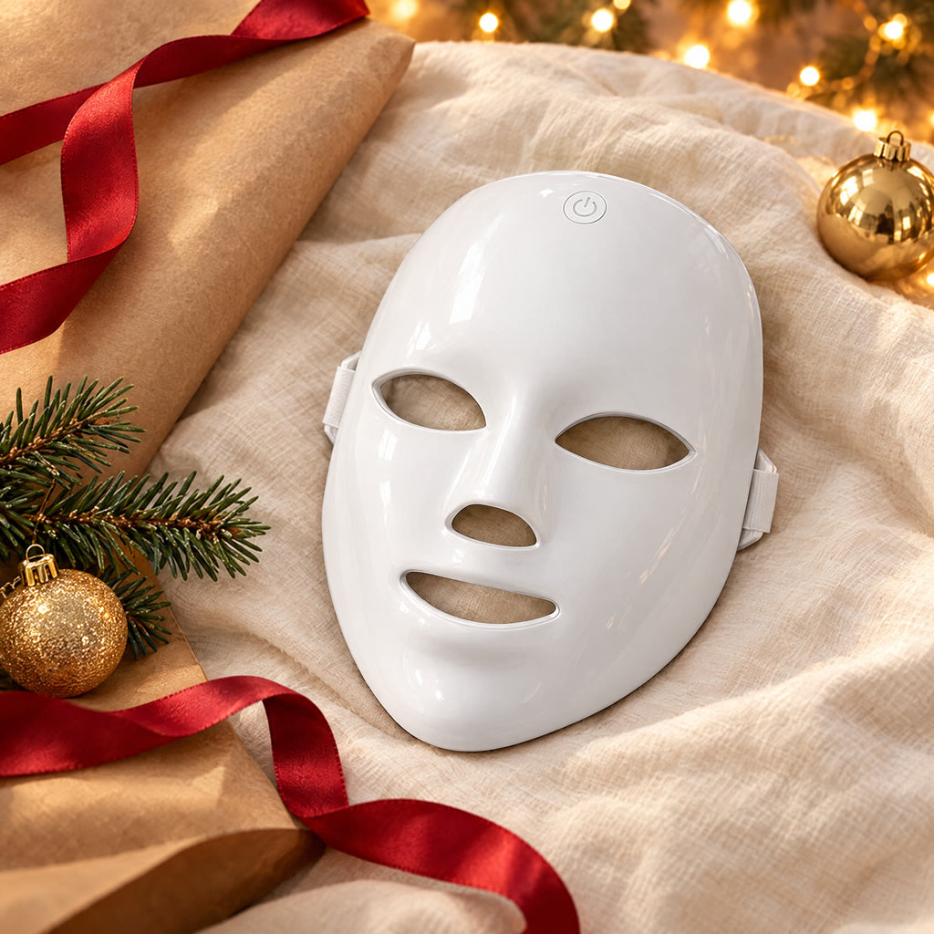 LED face mask with Christmas wrapping paper and a red ribbon